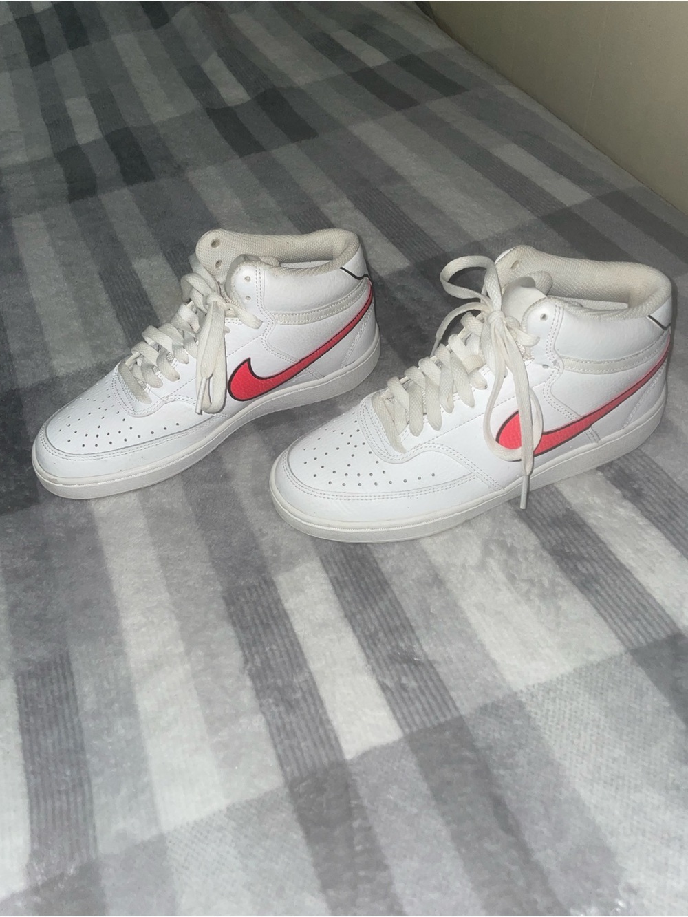 Nike White High-Top Sneakers with Pink Swoosh